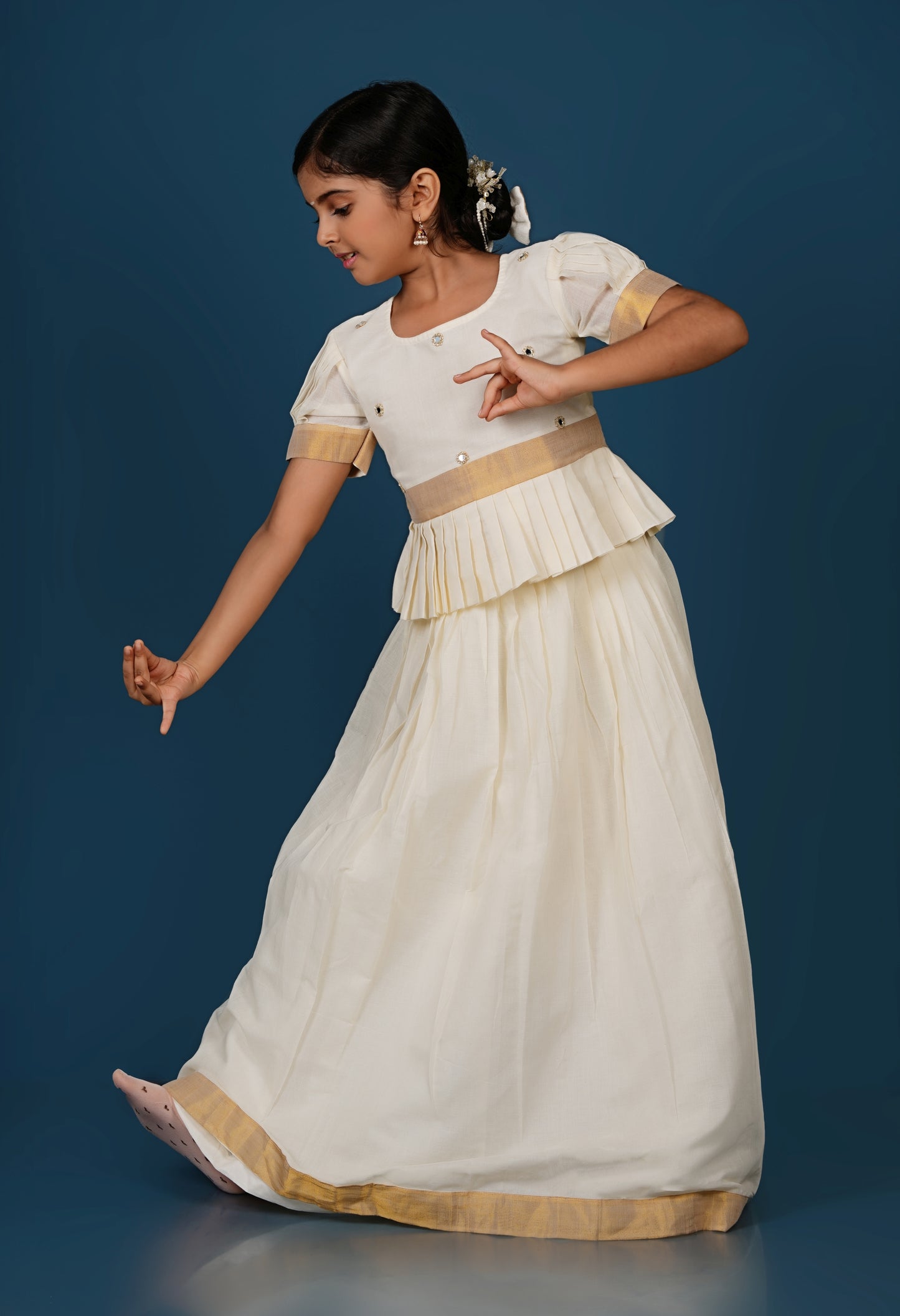 Glimmering Cream Peplum Top with Golden-Bordered Lehenga Set