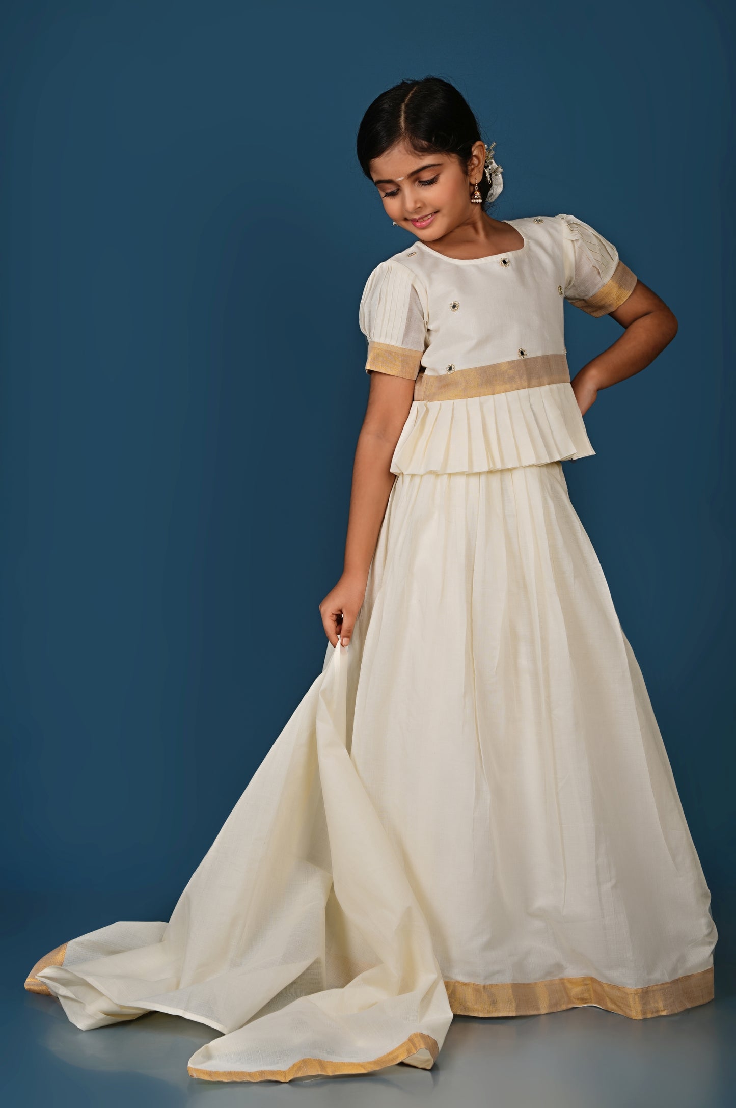 Glimmering Cream Peplum Top with Golden-Bordered Lehenga Set