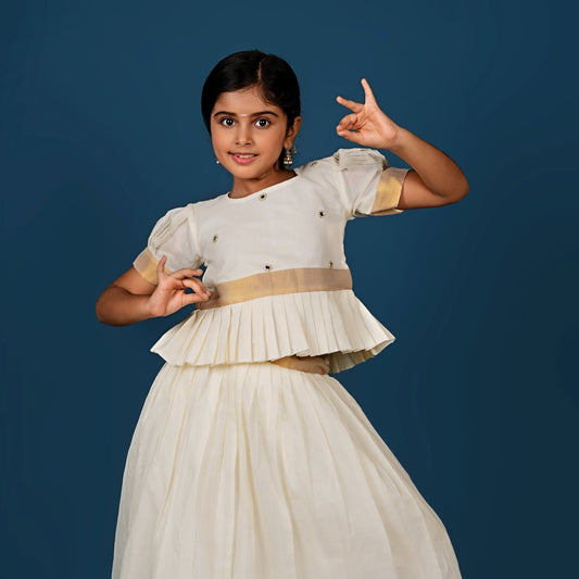 Glimmering Cream Peplum Top with Golden-Bordered Lehenga Set